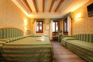TV in/ali zabaviščno središče v nastanitvi Hotel Da Bruno