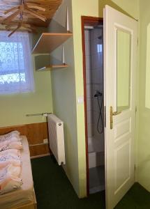 Postel nebo postele na pokoji v ubytování Horská chata LADA