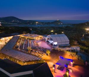 an aerial view of a building at night at Chia Laguna - Hotel Village in Chia