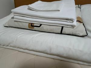 Postel nebo postele na pokoji v ubytování 広々な150平米無料駐車場一台