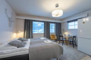 Кровать или кровати в номере Kuukkeli Apartments +22 фотографии