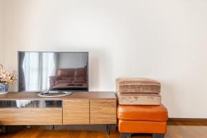 TV a/nebo společenská místnost v ubytování 広々な150平米無料駐車場一台