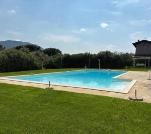 a large swimming pool in the middle of a yard at Appartamento vista Lago Sarnico in Sarnico