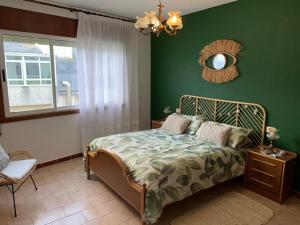 Ένα ή περισσότερα κρεβάτια σε δωμάτιο στο Apartamento Playa de Foz