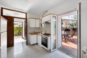 Kuchyň nebo kuchyňský kout v ubytování Villa Zafferano Suites - Mirto
