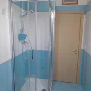 a shower with a glass door in a bathroom at La Casa di Raffa in Agropoli +26 photos