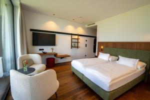 Posteľ alebo postele v izbe v ubytovaní Hotel Tenz