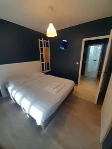 Ένα ή περισσότερα κρεβάτια σε δωμάτιο στο Hotel HEB