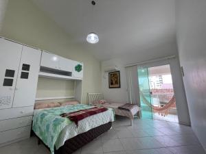 Postel nebo postele na pokoji v ubytování A Pérola do Gravatá