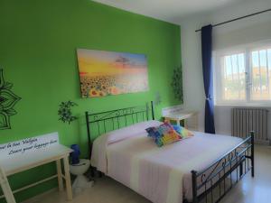 Ένα ή περισσότερα κρεβάτια σε δωμάτιο στο CasaOltreMare Puglia Mare, Relax e Tradizione