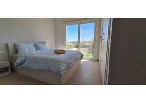 a bedroom with a bed with a teddy bear on it at El Gouna Waterside, 2-Bd Ground Floor Sleeps 4 Persons in Hurghada +43 photos