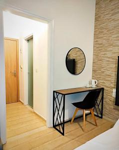A bed or beds in a room at Tina Hotel