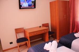 Voodi või voodid majutusasutuse Albergo Hotel Giardino toas