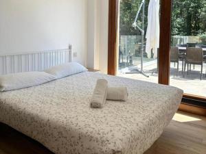 Postel nebo postele na pokoji v ubytování Top Sanxenxo 3000