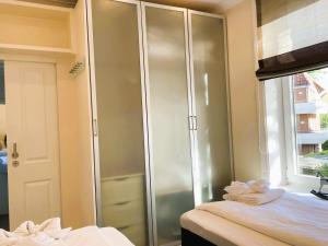 Giường trong phòng chung tại Südstrand- Inselstübchen 7, Gmelinstraße