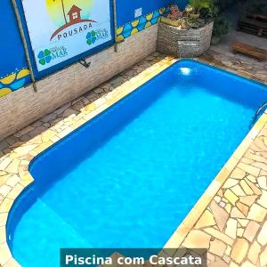 Bazén v ubytování Pousada Recanto Tangará - 5 min de carro do Centro histórico - Ambiente Familiar - Piscina e Estacionamento incluso nebo v jeho okolí