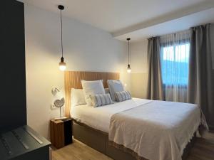 เตียงในห้องที่ Feelathome Vil-la Romana