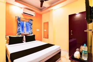 Ένα ή περισσότερα κρεβάτια σε δωμάτιο στο Hotel O CITY PLACE