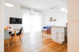 a kitchen and living room with a table and chairs at Pathway To The Sea in Pieve Ligure