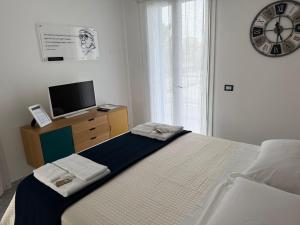 Postel nebo postele na pokoji v ubytování La Scala Suite
