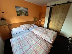 Postel nebo postele na pokoji v ubytování Apartmány Forest