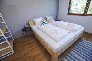 Postel nebo postele na pokoji v ubytování Terrassenwohnung 6