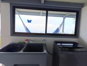 a kitchen with a sink and a window at Finca Alta Vista Monteverde in Monteverde Costa Rica