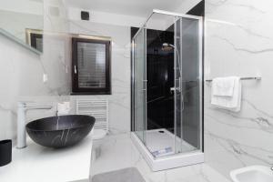 a bathroom with a glass shower and a black tub at NEW! Apartment in Petrčane 30 meters from the sea - TA Leut Agency in Petrcane +75 photos