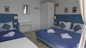 Cama o camas de una habitación en Coral
