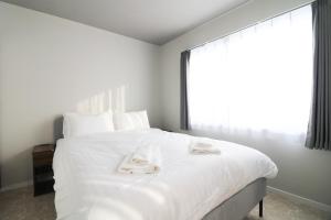 En eller flere senge i et værelse på Maison Odori Higashi Building