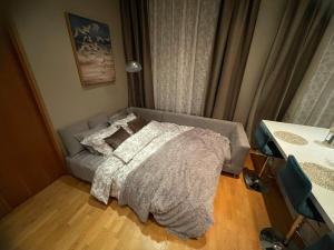 Postel nebo postele na pokoji v ubytování Kunderi apartment with sauna