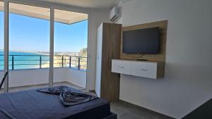 Ένα ή περισσότερα κρεβάτια σε δωμάτιο στο Sea View Apartments +16 φωτογραφίες