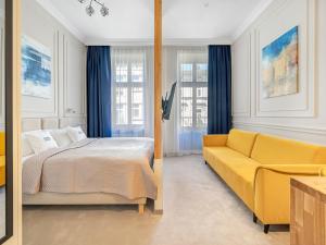 Postel nebo postele na pokoji v ubytování WSCHODNIA ELEGANS Aparthotel