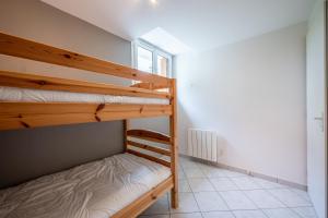 Ένα ή περισσότερα κρεβάτια σε δωμάτιο στο Appartement T2