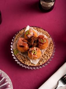 a plate of food on a purple table at Willa Berlińska - pokoje ,restauracja in Kościan +119 photos