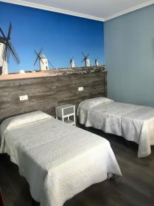 Posteľ alebo postele v izbe v ubytovaní Hostal imperio