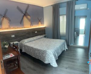 Posteľ alebo postele v izbe v ubytovaní Hostal imperio