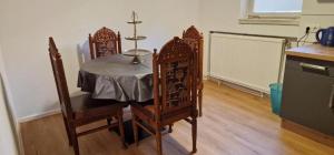 a dining room table with a cross on top of it at Blumlage 3 in Celle