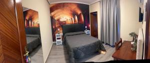 Posteľ alebo postele v izbe v ubytovaní Hostal imperio