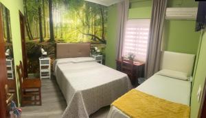 Posteľ alebo postele v izbe v ubytovaní Hostal imperio