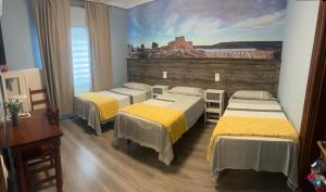 Posteľ alebo postele v izbe v ubytovaní Hostal imperio