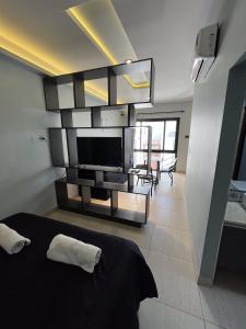 TV a/nebo společenská místnost v ubytování Departamentos Muskuy - Salta Capital