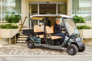 a man is sitting in a golf cart at Hotel Las Vegas in Lido di Jesolo +50 photos