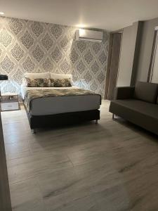 Postel nebo postele na pokoji v ubytování Hotel Mediterraneo