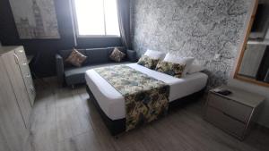 Postel nebo postele na pokoji v ubytování Hotel Mediterraneo