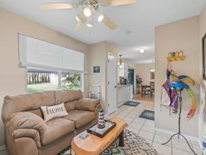 a living room with a couch and a table at 1632 Z1 Village of Orange Blossom Gardens by REMAX Premier in The Villages