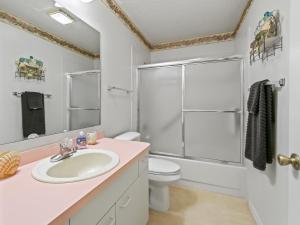 a bathroom with a sink and a toilet and a shower at 1632 Z1 Village of Orange Blossom Gardens by REMAX Premier in The Villages +16 photos