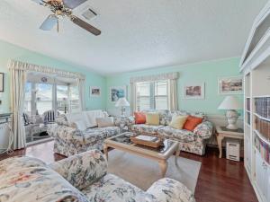 a living room with a couch and a table at 1705 Z1 Village of Orange Blossom Gardens by REMAX Premier in The Villages
