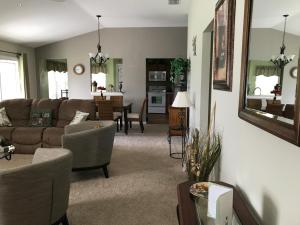 a living room with a couch and a table at 2383 Z3a VILLAGE OF TAMARIND GROVE by REMAX Premier in The Villages