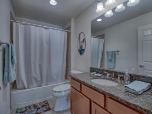 a bathroom with a sink and a toilet and a shower at 2463D Z4a VILLAGE OF COLLIER by REMAX Premier in The Villages +34 photos